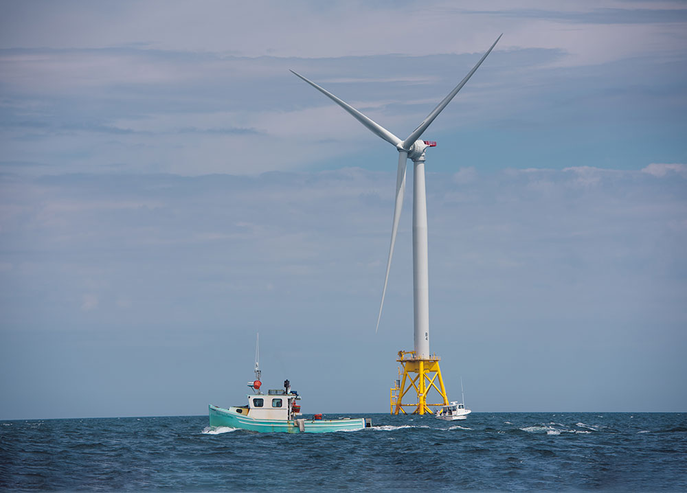 Fishing Boats Near Wind Turbine