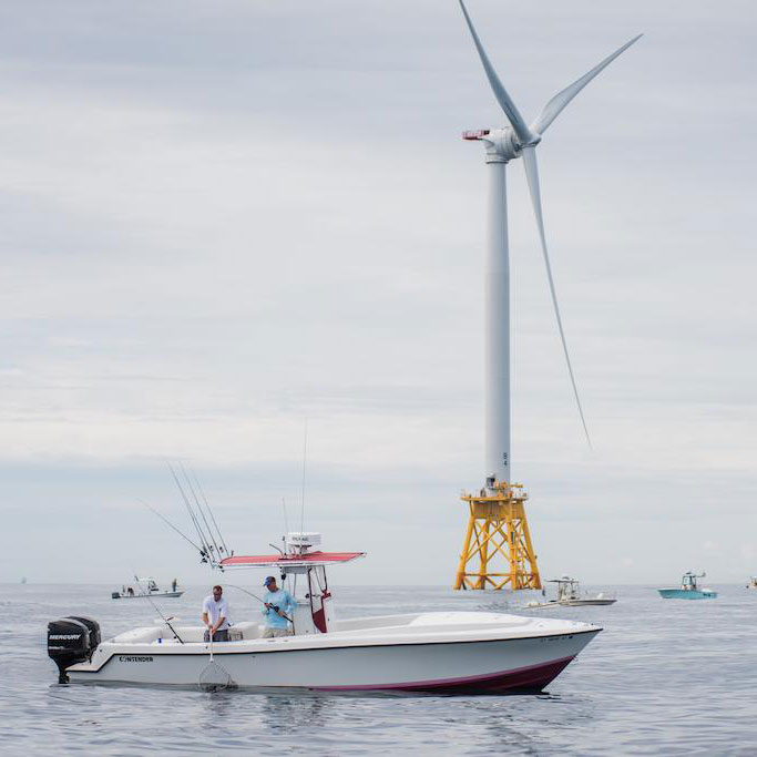 Two Men Fishing on Boat Near Turbine